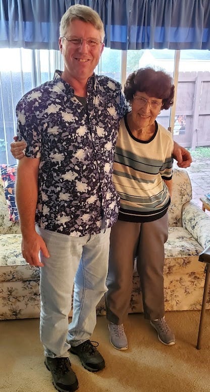Wrecked Car. Daughter in Hospital Bed. Art and Monica before dinner the day of Nicoles car accident. They are both smiling and looking forward to dinner. They're standing in front of her window.