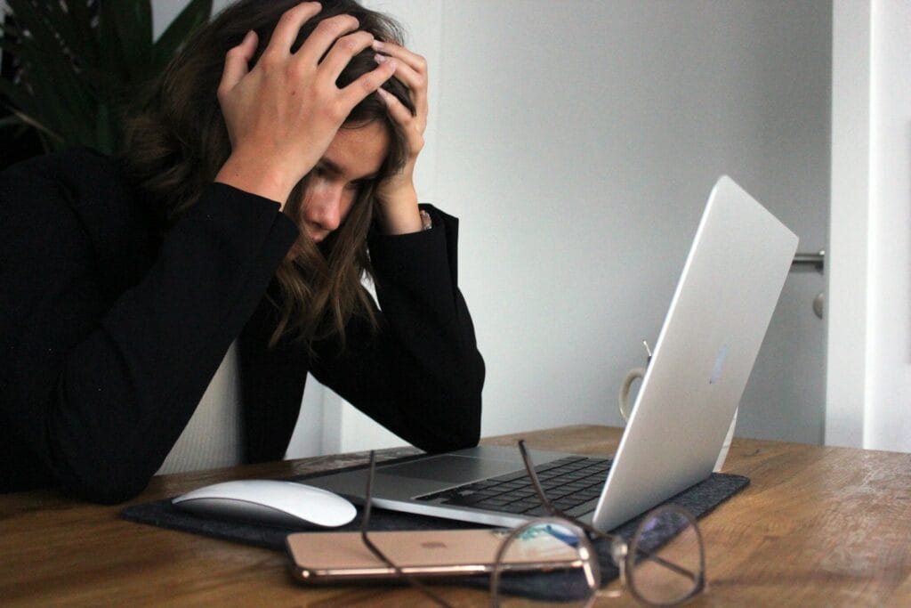 i want to be my own boss what can i do? a woman sitting in front of a laptop computer