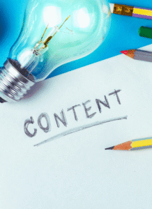 Content pillars. a paper with the word content, written in pencil. there's a pencil next to it and a light bulb too.