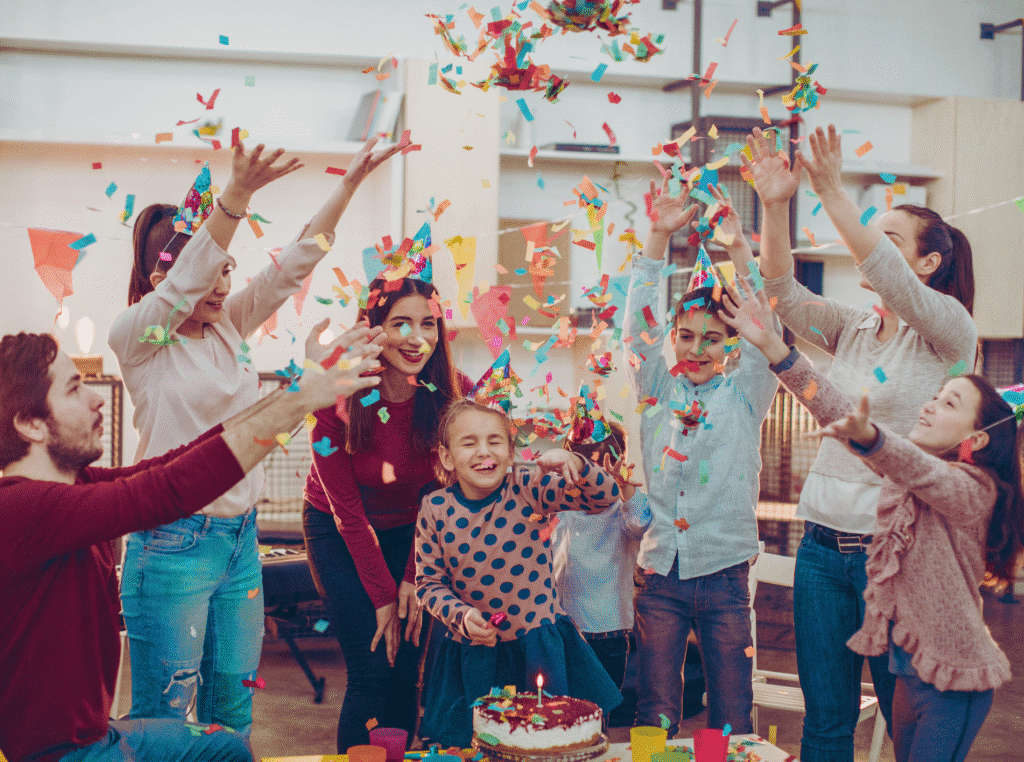 Live Life Without Regrets. birthday party throwing confetti with kids laughing.