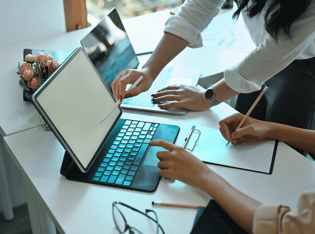 What is an entrepreneur. two women looking at a laptop and one is pointing something out.