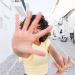 faceless video ideas woman hiding from camera with her hands