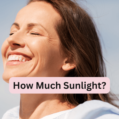 How Much Sunlight Do You Need A Day. woman smiling looking up to the sunlight. and the words on the front of the image: how much sunlight?