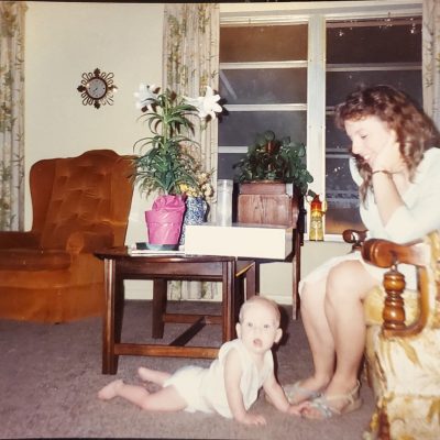 Open Heart Surgery Survivor. Me and James when he was a baby. He's on the floor looking at the camera and I'm sitting on the chair looking at him with my eyes full of love. I miss those days.