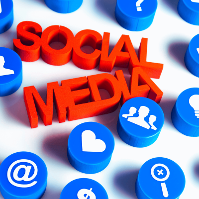 Social Media Is Not Real Life. the words social media in the center and all kinds of emoji images around like the @ sign, question mark, heart, people, etc.