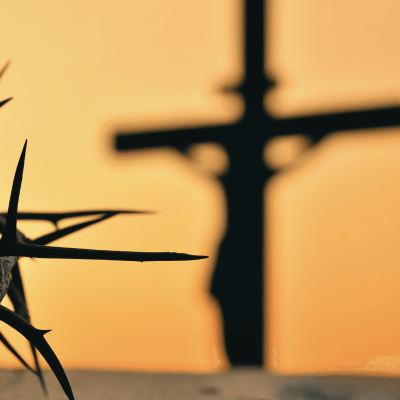 be a good person. image of a cross in the background and part of Jesus's crown of thorns in the front left of the picture.
