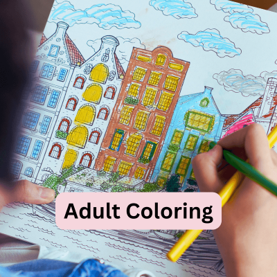 coloring books for adults. over the shoulder view of a woman coloring a page of high rise buildings with colored pencils.