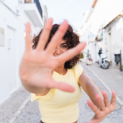 faceless video ideas woman hiding from camera with her hands