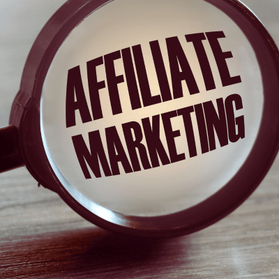 how do i learn affiliate marketing no experience. this is a magnifying glass and through the lens are the words affiliate marketing.