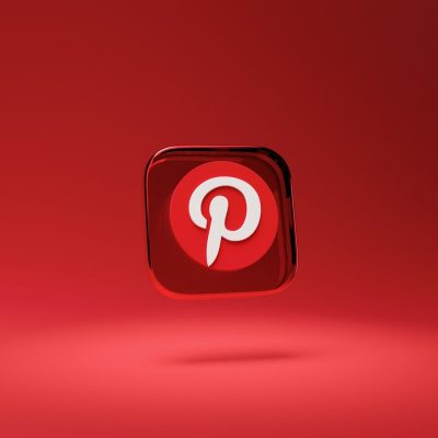 How to use Pinterest for business? a red square button with a pin on it that looks like the pinterest logo